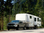 Truck pulling a camper at Hotel RV West - thumbnail
